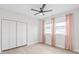 Bedroom with ceiling fan, large closet, and bright pink curtains at 1832 Montclair Ave, Gastonia, NC 28054
