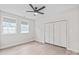 Spacious bedroom with ceiling fan and a large closet at 1832 Montclair Ave, Gastonia, NC 28054