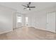 Bedroom featuring a ceiling fan, hardwood floors, natural light, and an en-suite bathroom with a walk-in shower at 1832 Montclair Ave, Gastonia, NC 28054