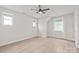 Bright bedroom with a ceiling fan, hardwood floors, and natural light from multiple windows at 1832 Montclair Ave, Gastonia, NC 28054