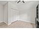 Bedroom with ceiling fan, light-colored flooring, and modern closet at 1832 Montclair Ave, Gastonia, NC 28054