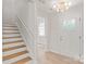Inviting entryway features hardwood stairs, modern lighting, and a bright, open feel at 1832 Montclair Ave, Gastonia, NC 28054