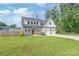 Attractive two-story home with well-kept lawn, two-car garage, and inviting red front door at 1832 Montclair Ave, Gastonia, NC 28054