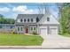 Charming two-story home with a well-manicured front yard and a two-car garage at 1832 Montclair Ave, Gastonia, NC 28054