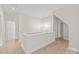 Hallway featuring hardwood floors, modern lighting, and access to various rooms in the house at 1832 Montclair Ave, Gastonia, NC 28054