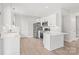 Modern kitchen with stainless steel appliances, white cabinets, and a stylish breakfast bar at 1832 Montclair Ave, Gastonia, NC 28054