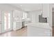 Bright kitchen with stainless steel appliances, white cabinets, and quartz countertops at 1832 Montclair Ave, Gastonia, NC 28054