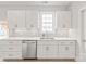 Well-lit kitchen features stainless steel appliances, white cabinetry, and backsplash at 1832 Montclair Ave, Gastonia, NC 28054