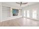Bright living area with built-in shelves, a decorative fireplace, and backyard access at 1832 Montclair Ave, Gastonia, NC 28054