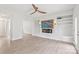 Spacious living room featuring built-in shelves, a ceiling fan, and a decorative fireplace at 1832 Montclair Ave, Gastonia, NC 28054