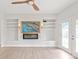 Cozy living room with built-in shelves, modern fireplace, and patio access at 1832 Montclair Ave, Gastonia, NC 28054