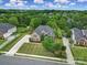 Aerial view of beautiful brick home with lush landscaping in a serene neighborhood at 2218 Legacy Oak Dr, Waxhaw, NC 28173