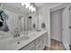 Bright bathroom with a long vanity offering ample counter space and storage and a doorway into another room at 2218 Legacy Oak Dr, Waxhaw, NC 28173