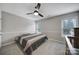 Comfortable bedroom featuring a ceiling fan, neutral walls, and plush carpet floors at 2218 Legacy Oak Dr, Waxhaw, NC 28173