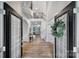 Elegant two-story foyer with hardwood floors, spiral staircase, and decorative chandelier showcases a grand entrance at 2218 Legacy Oak Dr, Waxhaw, NC 28173