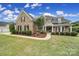 Beautiful brick home with manicured lawn, black shutters, and inviting entrance at 2218 Legacy Oak Dr, Waxhaw, NC 28173
