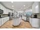 Bright and airy kitchen with island, granite countertops, stainless steel appliances, and ample cabinet space at 2218 Legacy Oak Dr, Waxhaw, NC 28173