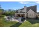 Beautiful backyard with a pool, patio, and well-maintained lawn at 2309 Ethan Way, Weddington, NC 28104
