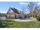 Lush backyard featuring a sparkling pool, patio area, and beautiful landscaping at 2309 Ethan Way, Weddington, NC 28104