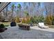 Outdoor patio with a dining set, grill, and lounge chair, perfect for entertaining at 2309 Ethan Way, Weddington, NC 28104