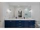 Elegant bathroom featuring a dual sink vanity with white countertop and modern fixtures at 2309 Ethan Way, Weddington, NC 28104