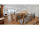 Spacious bonus room with hardwood floors and an ornate wrought iron staircase at 2309 Ethan Way, Weddington, NC 28104
