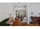 Inviting foyer showcases hardwood floors and an elegant staircase leading to the upper level at 2309 Ethan Way, Weddington, NC 28104