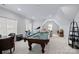 Large game room featuring a pool table, sitting area, and ample natural light at 2309 Ethan Way, Weddington, NC 28104