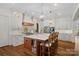 Gourmet kitchen with a large center island, custom cabinetry, and modern appliances for culinary enthusiasts at 2309 Ethan Way, Weddington, NC 28104