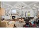 Inviting living room with a stone fireplace, built-in shelving, and an open layout for seamless entertaining at 2309 Ethan Way, Weddington, NC 28104