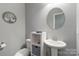 Stylish half-bathroom featuring a pedestal sink, toilet, and modern decor at 2489 Highway 161 S Hwy, York, SC 29745