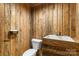 Country style half-bath with wooden wall panels and an integrated wooden sink and counter at 2489 Highway 161 S Hwy, York, SC 29745