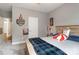 Bedroom with wood bed frame, ceiling fan, and sports-themed décor at 2489 Highway 161 S Hwy, York, SC 29745