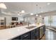Open-concept kitchen island with stainless steel sink and views of the living room at 2489 Highway 161 S Hwy, York, SC 29745
