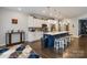 A newly renovated kitchen with white cabinets, blue island, stainless appliances, and hardwood floors at 2489 Highway 161 S Hwy, York, SC 29745