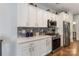 Well-lit kitchen featuring white cabinets, stainless steel appliances, and backsplash at 2489 Highway 161 S Hwy, York, SC 29745