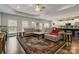 A large living room with hardwood floors, a ceiling fan and an open view of the kitchen at 2489 Highway 161 S Hwy, York, SC 29745