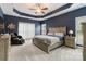 Spacious main bedroom with a tray ceiling, neutral carpet, and a comfortable king bed at 2489 Highway 161 S Hwy, York, SC 29745