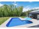 Enjoy the backyard with a swimming pool surrounded by lush landscaping with covered barbeque area at 2489 Highway 161 S Hwy, York, SC 29745