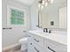 This bathroom features a sink and a large mirror at 2544 Cedarwild Rd, Charlotte, NC 28212