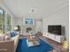 Bright living room with a cozy sofa, stylish lighting, a decorative fireplace, and modern decor at 2544 Cedarwild Rd, Charlotte, NC 28212