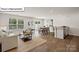 Open-concept living area with lots of natural light, seamlessly connecting the living room and dining area at 2927 Penninger Cir, Charlotte, NC 28262