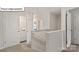 Hallway with stairs, laundry closet, and white walls, enhancing the home's modern feel at 2931 Penninger Cir, Charlotte, NC 28262