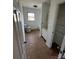 Bathroom featuring a classic white toilet, vanity, and built-in storage, highlighted by a window for natural light at 3048 Marigold Ln, Gastonia, NC 28052