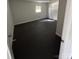Bedroom with light walls and dark flooring, complemented by natural light streaming in through the window at 3048 Marigold Ln, Gastonia, NC 28052