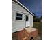 Exterior view of a white door with glass panes and brick stairs at 3048 Marigold Ln, Gastonia, NC 28052