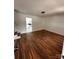 Inviting living room featuring hardwood floors and an open view to the kitchen at 3048 Marigold Ln, Gastonia, NC 28052
