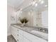 Bright bathroom featuring granite countertops, double sinks, and shower at 3101 Auburn Ave, Charlotte, NC 28209