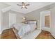 Cozy bedroom with wooden bed frame, ceiling fan and ensuite access at 3101 Auburn Ave, Charlotte, NC 28209