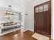 Dining area with a view from the entryway, showing the elegant furniture and lighting at 3101 Auburn Ave, Charlotte, NC 28209